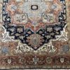 This hand knotted Indo Serapi rug lends a traditional feel to your favorite room. It carries a bold geo-floral design elements along with a pleasing balance of blue, natural and red colors.